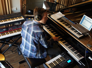 Thomas Hellsten surrounded by keyboards